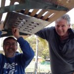 Robert and friend Paul re-installing the swim ladder